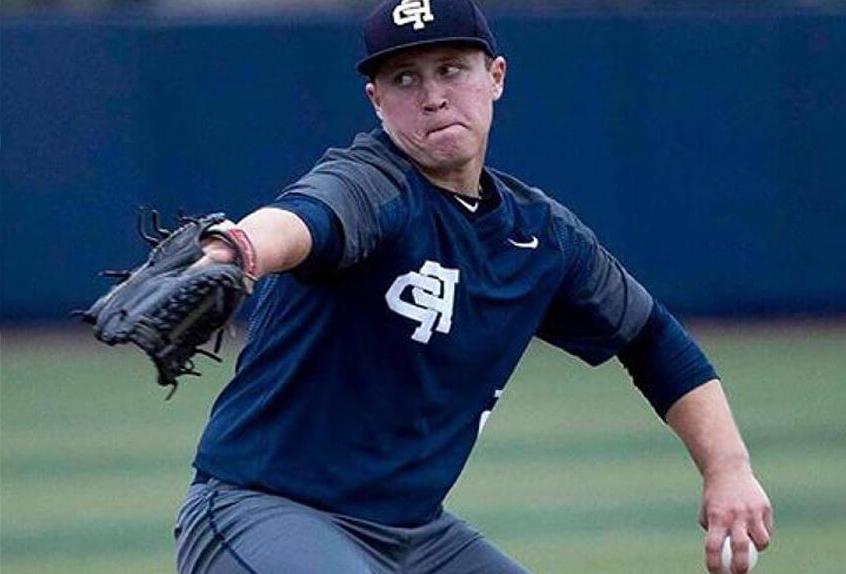 Poly Prep pitcher wound up to throw the pitch